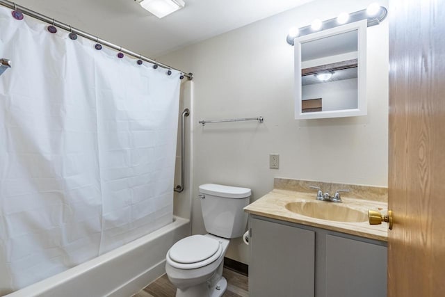 full bathroom featuring hardwood / wood-style flooring, vanity, toilet, and shower / tub combo with curtain