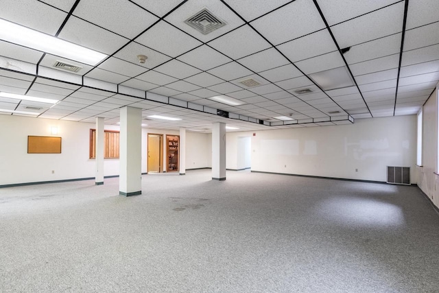 basement with carpet flooring and a drop ceiling