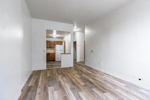 unfurnished living room featuring light hardwood / wood-style floors