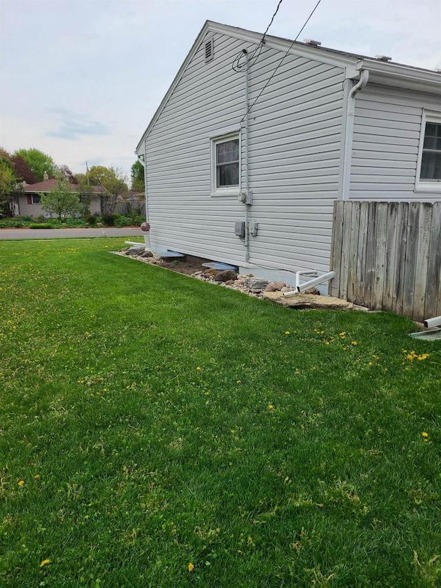 view of home's exterior featuring a yard