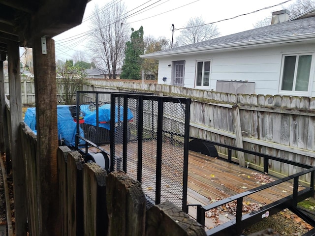 view of swimming pool with a wooden deck