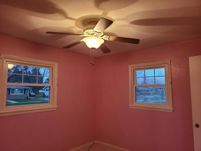 unfurnished room with ceiling fan