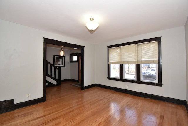 spare room featuring hardwood / wood-style floors