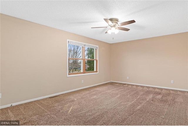 unfurnished room with carpet, a textured ceiling, and ceiling fan