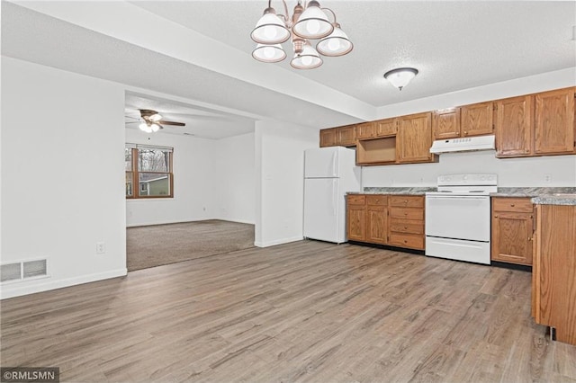 kitchen with light wood-type flooring, a textured ceiling, white appliances, ceiling fan with notable chandelier, and hanging light fixtures