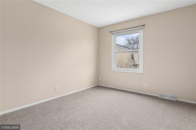 spare room featuring carpet flooring