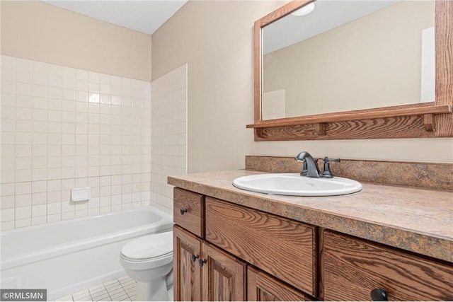 full bathroom with tile patterned floors, vanity, toilet, and tiled shower / bath