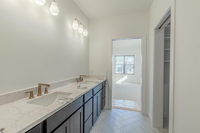 bathroom with tile patterned flooring and vanity