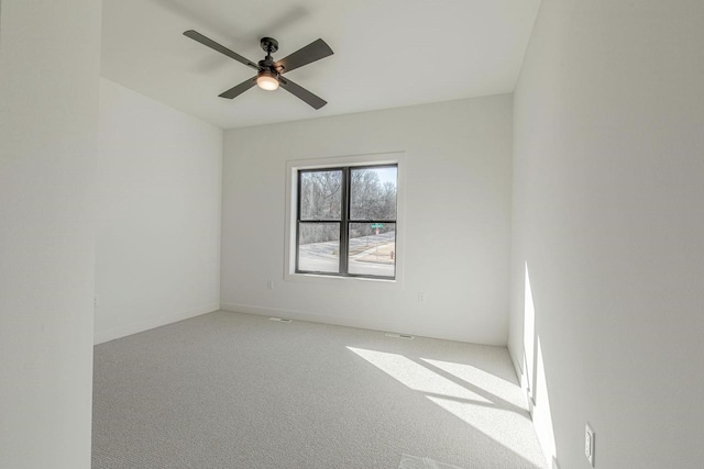 unfurnished room featuring carpet and ceiling fan