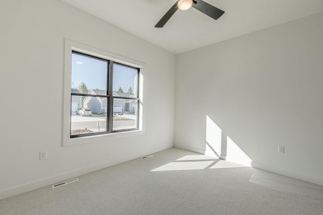 empty room with carpet flooring and ceiling fan