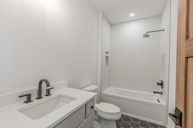 full bathroom with toilet, vanity, tiled shower / bath combo, and tile patterned flooring