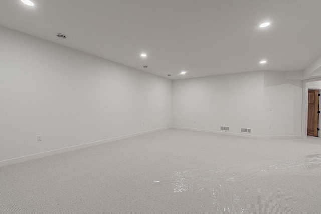 unfurnished room with light colored carpet