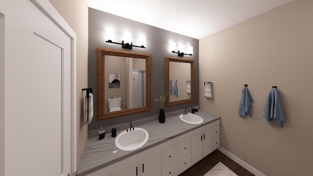 bathroom featuring hardwood / wood-style floors, vanity, and toilet