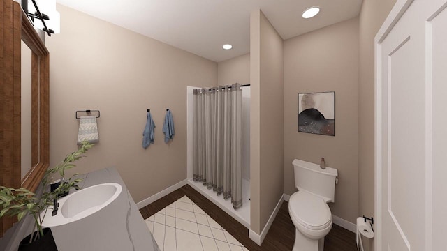 3615 S Business Dr Unit 105, Sheboygan, WI 53081 - full bath featuring toilet, vanity, wood finished floors, baseboards, and recessed lighting