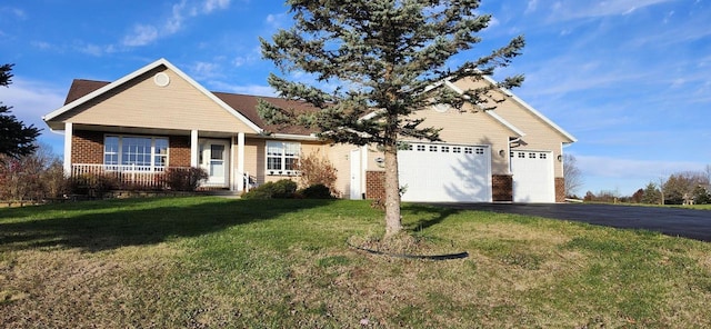 view of front of home featuring a garage and a front lawn