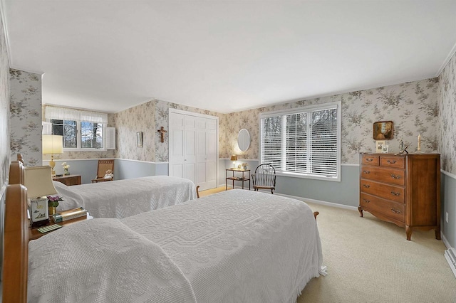 bedroom with light colored carpet and a closet