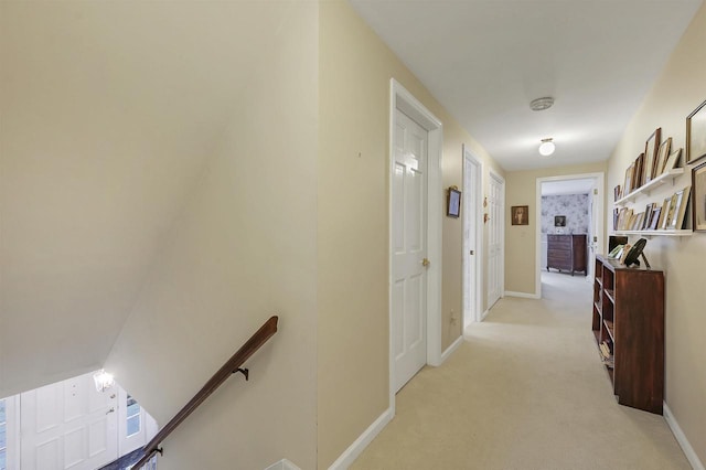 corridor with light colored carpet