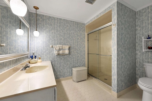 bathroom with crown molding, toilet, vanity, and walk in shower