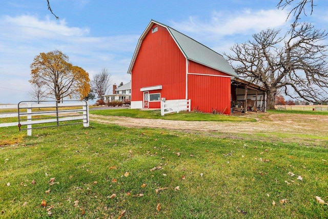 view of outdoor structure with a lawn