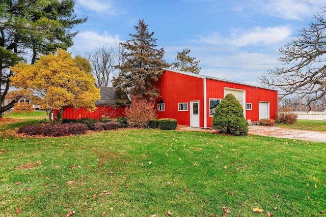 view of outbuilding with a lawn