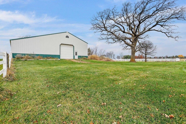 view of yard featuring an outbuilding and a garage