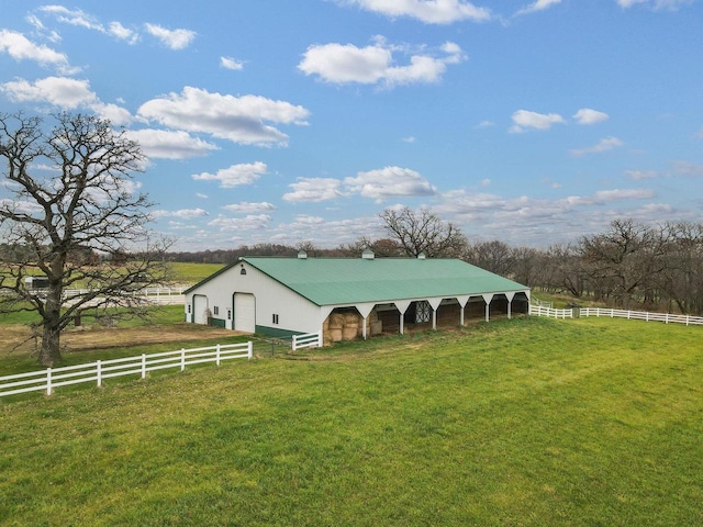 view of stable with a rural view