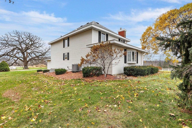 view of home's exterior with a yard