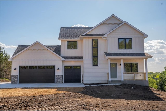 view of front of home with a garage and covered porch