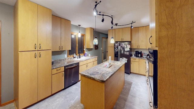 kitchen featuring a kitchen island, sink, hanging light fixtures, stainless steel appliances, and light stone countertops