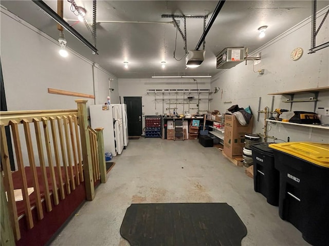 garage featuring white refrigerator and a garage door opener