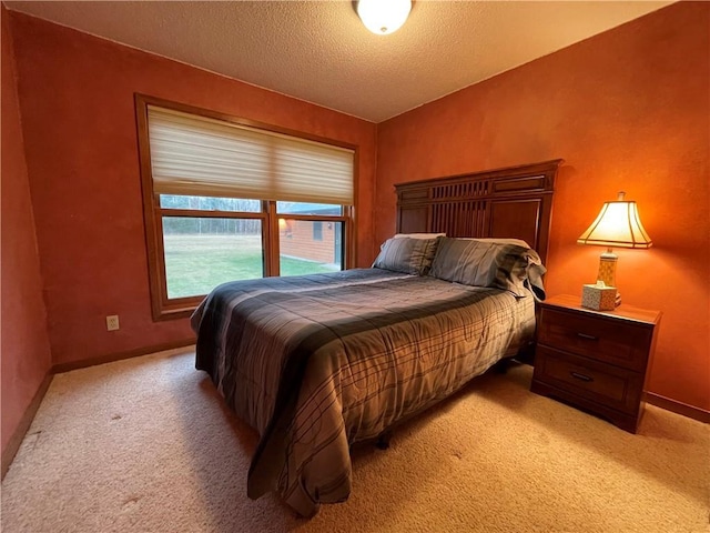 carpeted bedroom with a textured ceiling