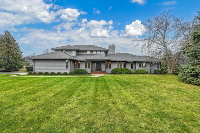 view of front of home with a front yard