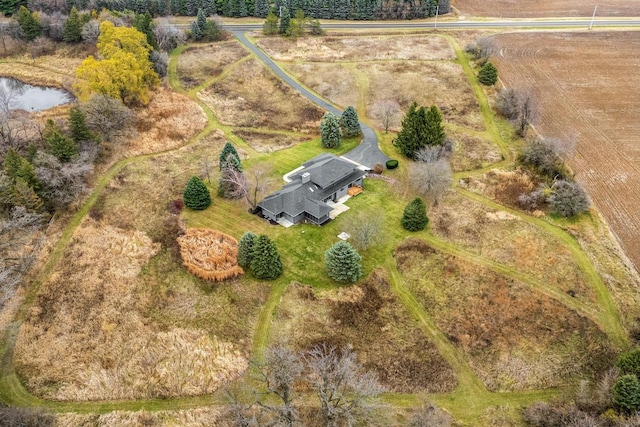 birds eye view of property featuring a rural view and a water view