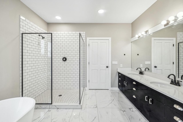 bathroom with vanity and independent shower and bath