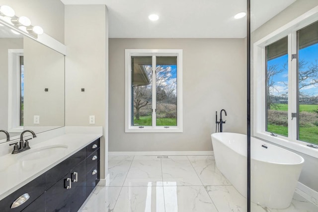 bathroom featuring a bathtub and vanity