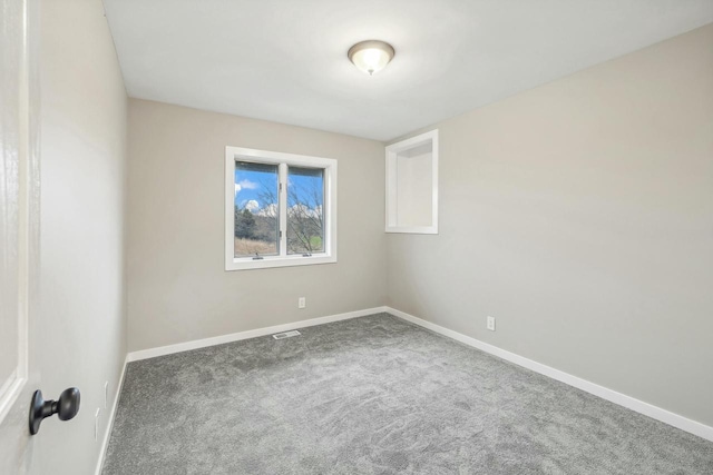 unfurnished room featuring carpet floors