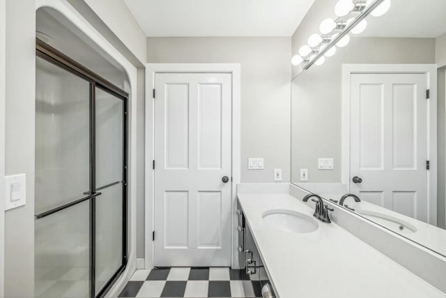 bathroom with vanity and an enclosed shower