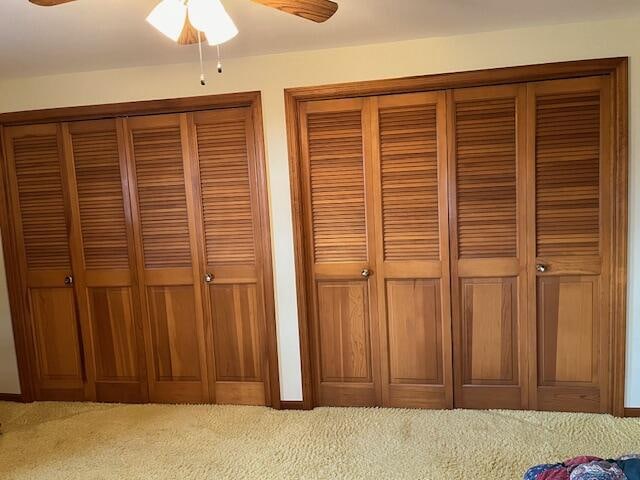 interior details with carpet floors and ceiling fan