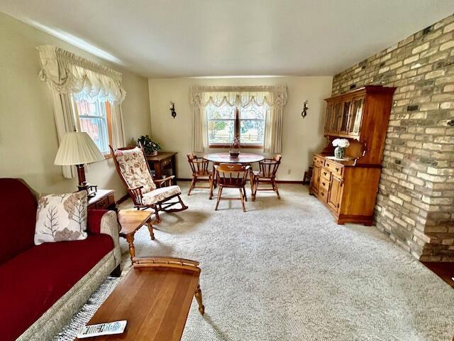 2628 Riverhills Rd, Two Rivers, WI 54241 - living area featuring light colored carpet and brick wall