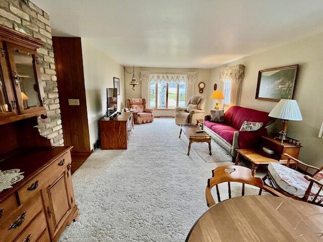 living area featuring light colored carpet