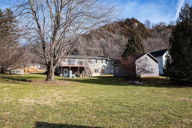 exterior space with a yard and a wooden deck