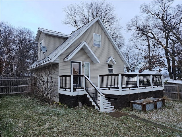 back of property with a wooden deck