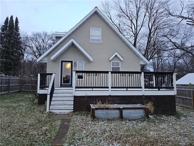 back of property featuring a wooden deck