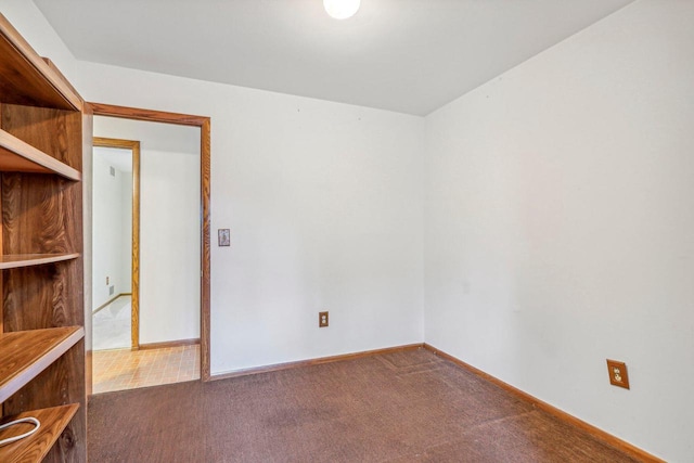 unfurnished room with carpet flooring