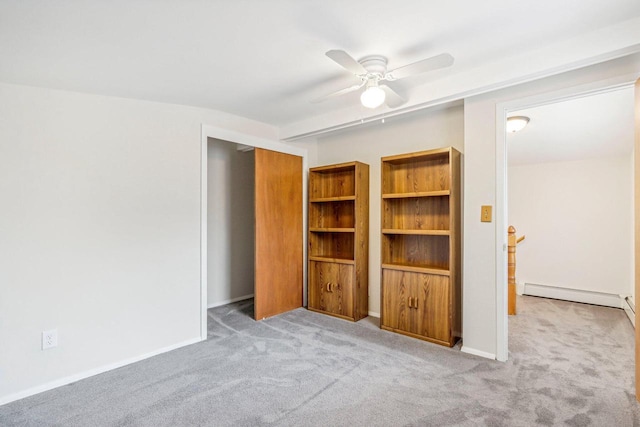 unfurnished bedroom with ceiling fan, a closet, light colored carpet, and a baseboard heating unit