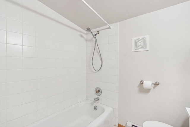 full bathroom featuring vanity, a baseboard radiator, toilet, and tiled shower / bath