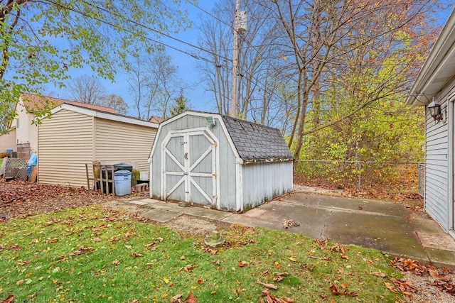 view of outbuilding with a lawn