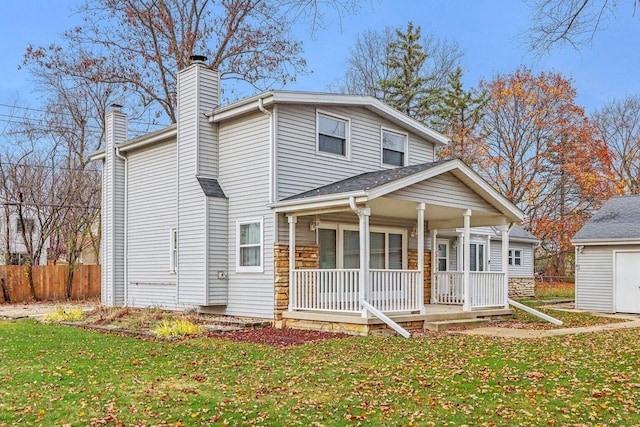 view of front of home featuring covered porch and a front lawn