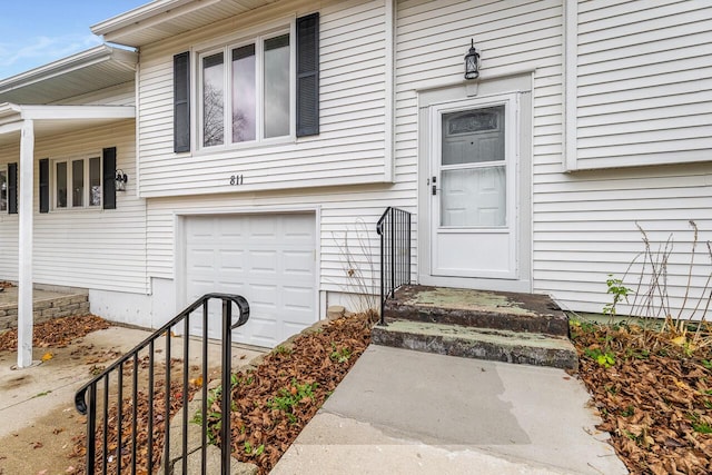 property entrance with a garage