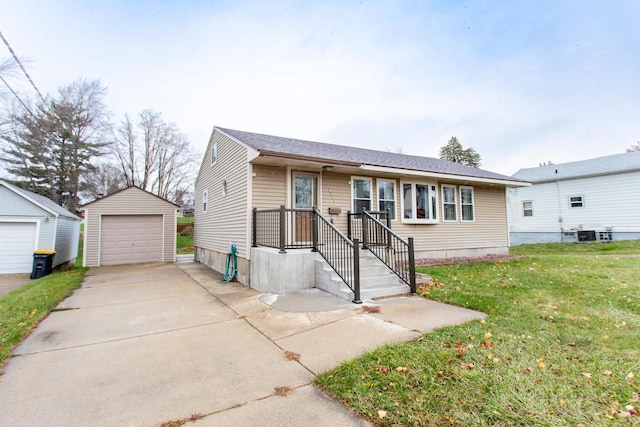 view of front facade featuring a garage, a front lawn, and an outdoor structure